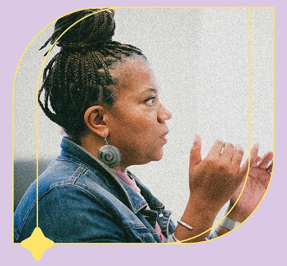 A woman speaks engagingly at a conference