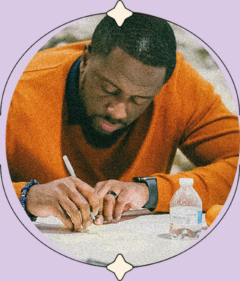 A man takes notes at a conference